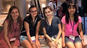 Four females smiling for camera